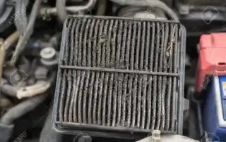 image of a dirty, old engine air filter