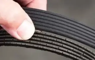 close up showing the wires on a serpentine belt