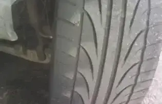 up close image of tire tread status on a vehicle